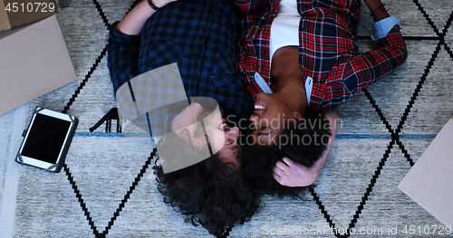 Image of Top view of attractive young multiethnic couple
