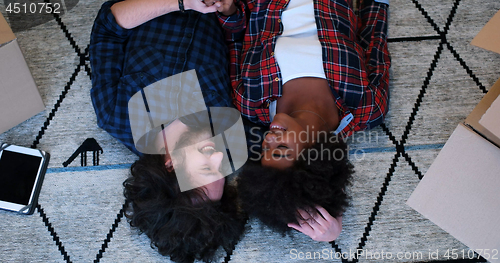 Image of Top view of attractive young multiethnic couple