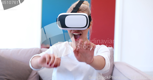 Image of woman using VR-headset glasses of virtual reality