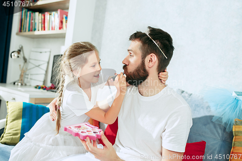 Image of Father and his six years kid girl at home