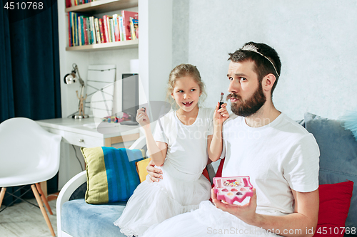 Image of Father and his six years kid girl at home