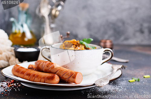 Image of sausages with cabbage