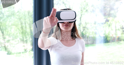 Image of woman using VR-headset glasses of virtual reality