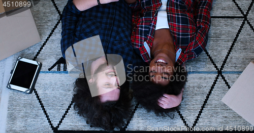 Image of Top view of attractive young multiethnic couple