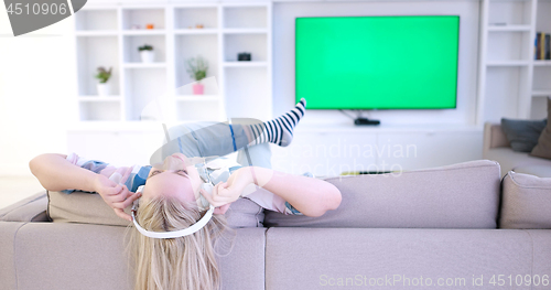 Image of girl enjoying music through headphones