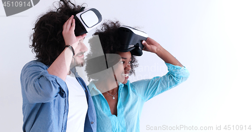 Image of multiethnic couple getting experience using VR headset glasses