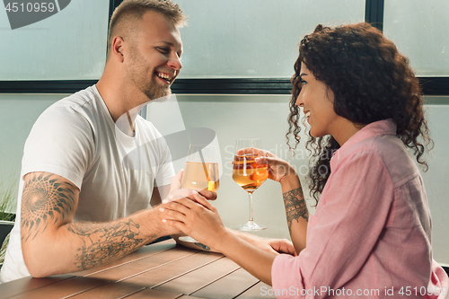 Image of She said him yes. Closeup of young man kissing his wife hand while making marriage proposal outdoors.