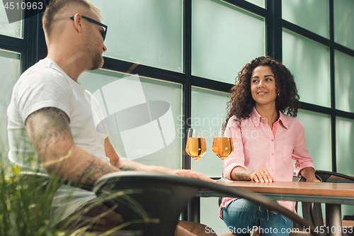 Image of She said him yes. Closeup of young man kissing his wife hand while making marriage proposal outdoors.