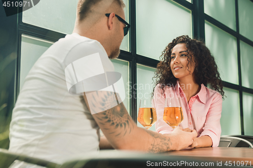 Image of She said him yes. Closeup of young man kissing his wife hand while making marriage proposal outdoors.