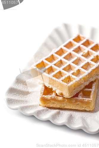 Image of Belgium waffers with sugar powder on ceramic plate isolated on w