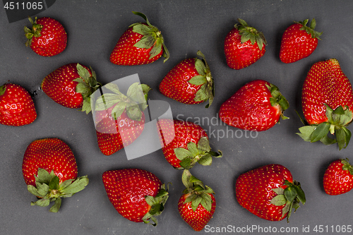 Image of Fresh ripe strawberries on black background.