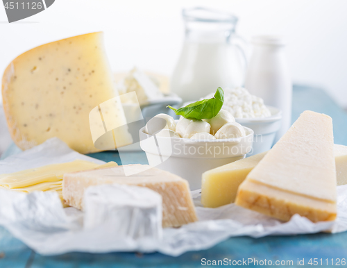 Image of Different types of dairy products on wooden background