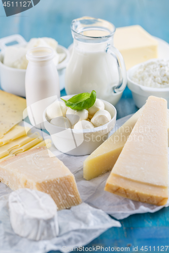 Image of Different types of dairy products on wooden background