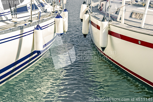 Image of Blue and red motorboats in the marina