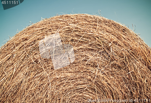 Image of Bale of hay under blue sky