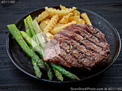 Image of plate of grilled beef fillet steak meat and vegetables
