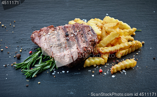 Image of grilled beef fillet steak and fried potatoes