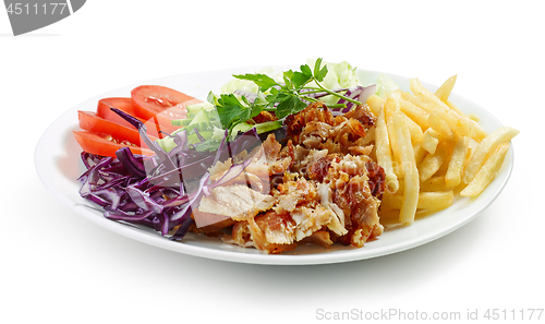 Image of plate of chicken kebab and vegetables