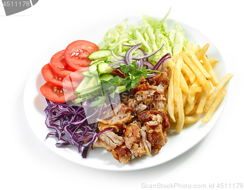 Image of plate of chicken kebab and vegetables