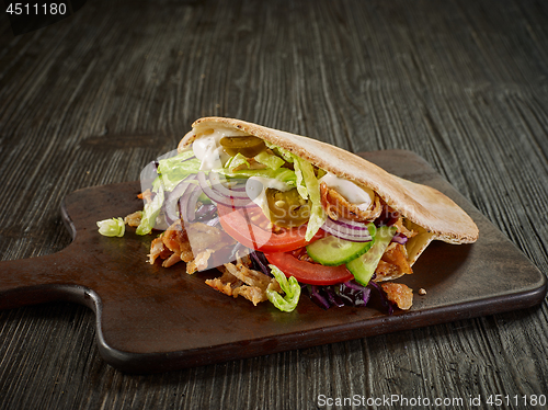 Image of doner kebab on wooden table