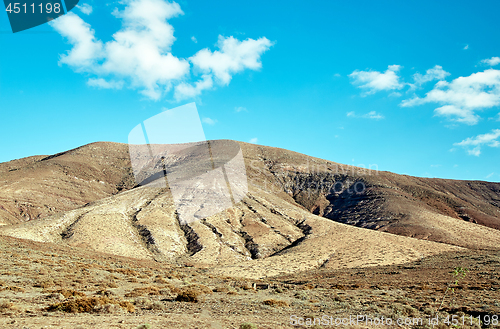 Image of Volcanic hills and blue sky