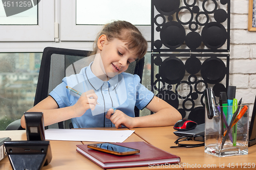 Image of Eight-year-old girl rejoices after signing another document