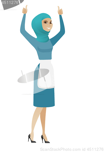Image of Young muslim cleaner standing with raised arms up.