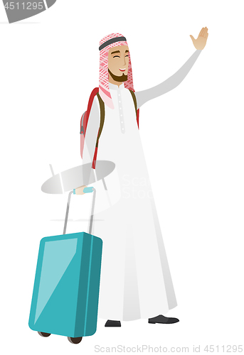 Image of Young muslim traveler waving his hand.