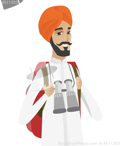 Image of Hindu traveler man with backpack and binoculars.