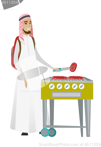 Image of Traveler man cooking steak on barbecue grill.