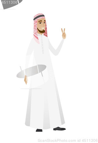 Image of Muslim businessman showing victory gesture.