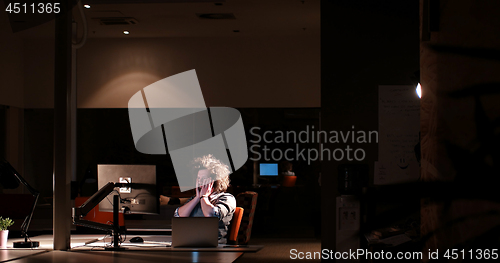 Image of businessman relaxing at the desk