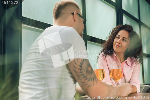 Image of She said him yes. Closeup of young man kissing his wife hand while making marriage proposal outdoors.