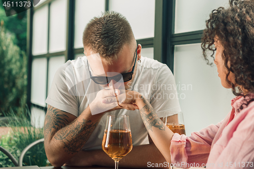 Image of She said him yes. Closeup of young man kissing his wife hand while making marriage proposal outdoors.