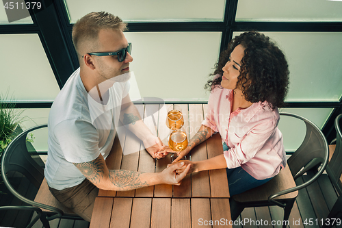 Image of She said him yes. Closeup of young man kissing his wife hand while making marriage proposal outdoors.