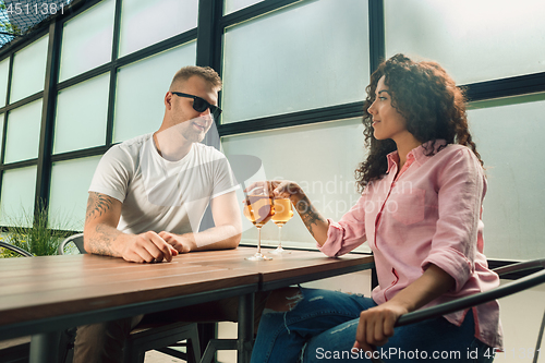 Image of She said him yes. Closeup of young man kissing his wife hand while making marriage proposal outdoors.