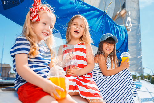 Image of The children on board of sea yacht