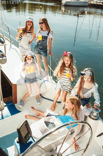 Image of The children on board of sea yacht