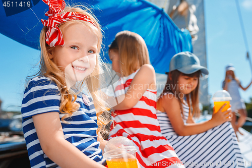 Image of The children on board of sea yacht