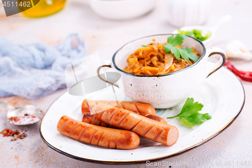 Image of sausages with cabbage