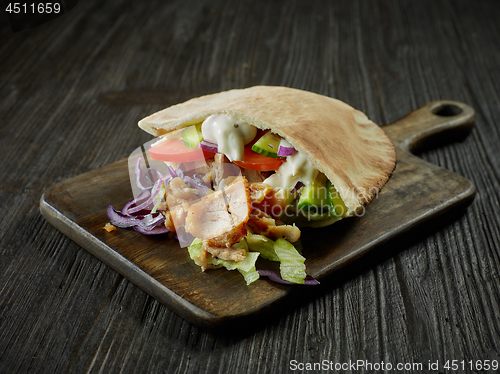 Image of doner kebab on wooden table