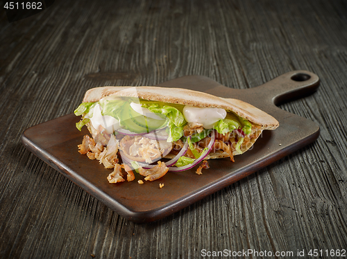 Image of doner kebab on wooden table