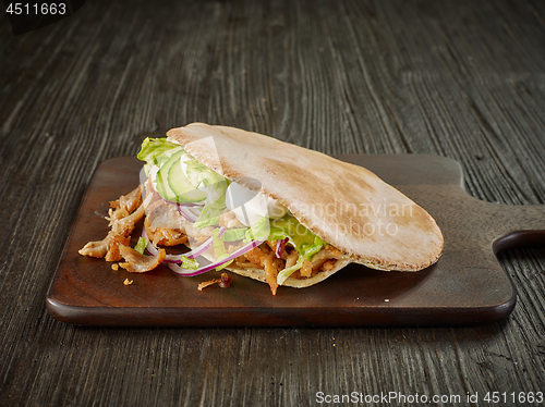 Image of doner kebab on wooden table