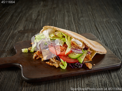 Image of doner kebab on wooden table