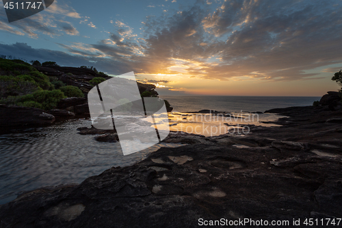 Image of Sunrise and views over the cliffs at Curracurong creek and falls