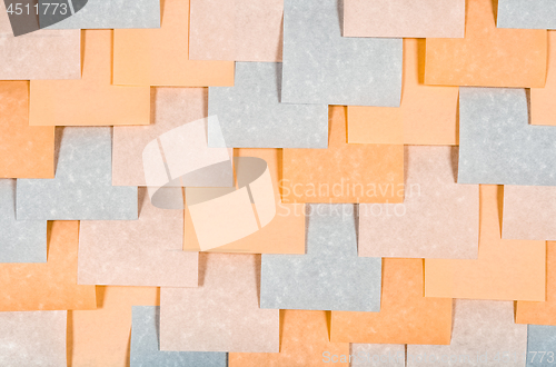 Image of Gray and peach colored blank notes