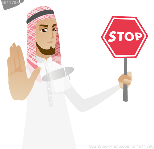 Image of Muslim businessman holding stop road sign.