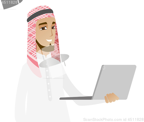 Image of Muslim businessman using laptop.