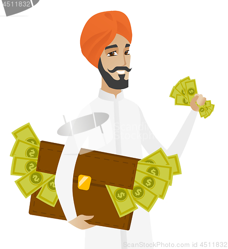 Image of Hindu businessman with briefcase full of money.