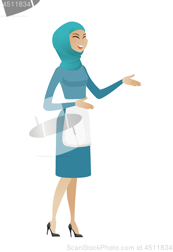Image of Young muslim happy cleaner gesturing.